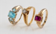 An 18ct gold ring and two 9ct gold rings, with stones including diamonds, rubies and topaz, 20th century, (3 items), 12 grams total