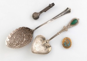 An antique sterling silver hem holder, together with a sterling silver spoon with repousse decoration, an Indian silver spoon with greenstone decoration, and an antique gold and enamel locket, 19th/20th century, (4 items).