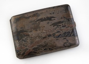 An antique Japanese silver and niello cigarette case inlaid with copper and gold, early 20th century, stamped "950", 11cm wide, 100 grams.