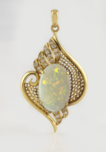 An 18ct yellow gold pendant, set with an impressive solid opal, surrounded by brilliant cut diamonds, 5cm high overall, 10.5 grams.
