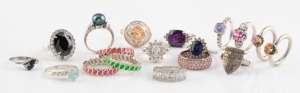 Eighteen assorted silver rings with stones.