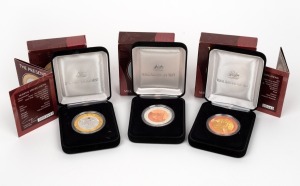 MILLENNIUM SERIES SILVER PROOFS: Group of three RAM coins, two of which gold-plated, all in original cases with box, comprising 1999 The Past, 2000 The Present, and 2001 The Future. (3 items)