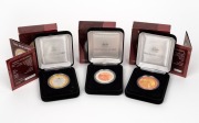 MILLENNIUM SERIES SILVER PROOFS: Group of three RAM coins, two of which gold-plated, all in original cases with box, comprising 1999 The Past, 2000 The Present, and 2001 The Future. (3 items)