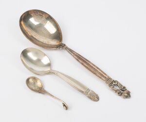 Two GEORG JENSEN Danish silver spoons and an English silver plated spoon (3 items), all with factory marks, the largest 16.5cm long