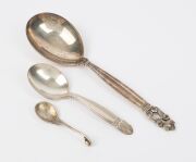 Two GEORG JENSEN Danish silver spoons and an English silver plated spoon (3 items), all with factory marks, the largest 16.5cm long