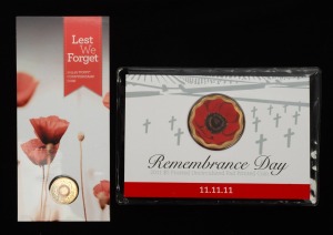 REMEMBRANCE DAY: Group of two RAM carded coloured coins, comprising 2011 $5 uncirculated Remembrance Day, together with 2015 $2 circulating 'Lest We Forget - Poppy' counterstamp. (2 items)