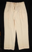 A pair of Clarrie Grimmett's pure wool cricket flannel trousers, circa 1930; with "GRIPU" label to rear waistband. This may have been a spare pair as they show no signs of wear or tear.