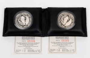 1990 $5 (1oz) Kookaburra silver Proof coins, (2) in the leather wallets of issue, with consecutively numbered certificates.