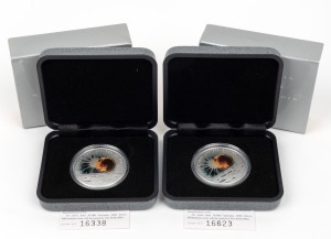 The Australia 2000 $1 silver Millennium Coin, (2), both in original presentation packaging with certificates of Authenticity.