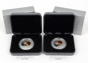 The Australia 2000 $1 silver Millennium Coin, (2), both in original presentation packaging with certificates of Authenticity.