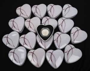 CAMEROON: 2010 1000fr Amour Toujours "Angels of Love" sterling silver hologram coins, each in an individual heart-shaped tin. (18).