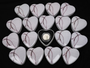 CAMEROON: 2010 1000fr Amour Toujours "Angels of Love" sterling silver hologram coins, each in an individual heart-shaped tin. (18).