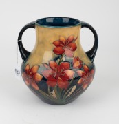 MOORCROFT "Protea" rare twin-handled English pottery vase, finely decorated with large protea flowers and the reverse decorated with a spray of African Lilies, circa 1928, impressed signature mark to base "W. Moorcroft, Potter to H. M. The Queen. Made in - 7