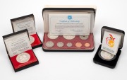 Papua New Guinea: 1975 eight coin Proof set, 1975 10k silver Proof, 1978 10k silver proof, 1991 10k silver South Pacific Games proof, all in cases of issue with certificates.