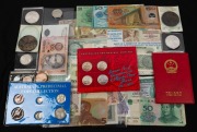 A diverse range including P.R.C. 1981 Uncirculated set of 7 in The People's Bank of China red folder, G.B. 1953 uncirculated set of 8, two uncirculated US silver dollars and an Unc Kennedy half-dollar, some Australian florins, various banknotes of PNG and