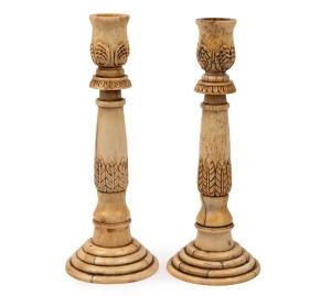 A rare pair of antique carved and turned whalebone and whale tooth candlesticks with acanthus leaf decoration, Tasmanian origin, circa 1830's, 20cm high. PROVENANCE: Private collection, Sandy Bay, Hobart, Tasmania.
