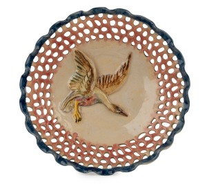 CASTLE HARRIS pierced pottery plate with applied flying duck decoration, incised "Castle Harris", 26.5cm wide.