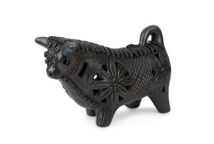 McLAREN pottery bull statue with unusual blue and charcoal glaze, incised "McLaren", 18cm high, 29cm long