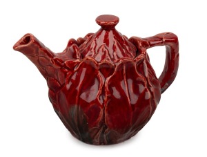 VIDA BRANDIS (HARVEY SCHOOL) red glazed pottery teapot with leaf decoration, incised signature to base, 12.5cm high, 19cm wide.