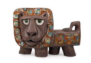 McLAREN pottery lion with unusual painted finish, incised "McLaren", 23cm high, 32cm long.