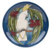 MOORCROFT "Sulphur Crested Cockatoo" pottery plate on blue ground, limited edition 52/350, retailed by Dalby Antiques Melbourne, circa 1995, factory mark to base, with original box of issue, 26.5cm diameter.