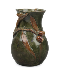 STAN and GEOFF GILBERT brown and green glazed pottery jug beautifully decorated with applied gumnuts, leaves and branches, incised "S. & G. Gilbert, Vic. Aust.", ​​​​​ 19cm high.