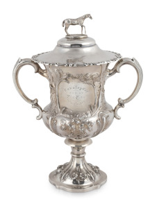 WILLIAM EDWARDS (attributed) "THE CAVALRY CUP" antique English sterling silver lidded trophy with finely cast horse finial and impressive repousse decoration of emus and kangaroo in landscape, manufactured by Samuel Hayne and Dudley Carter of London, circa 1856, engraved "Cavalry Cup won by The Fish, 27th August, 1885", 39cm high, 28.5cm wide, 1517 grams total.