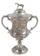 WILLIAM EDWARDS (attributed) "THE CAVALRY CUP" antique English sterling silver lidded trophy with finely cast horse finial and impressive repousse decoration of emus and kangaroo in landscape, manufactured by Samuel Hayne and Dudley Carter of London, circ - 4
