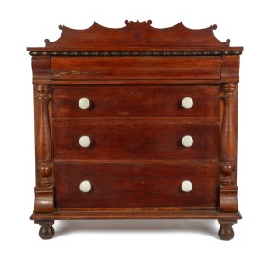 284 · A rare Colonial casuarina four drawer chest with turned split columns, grained decoration, porcelain knobs, ogee moulded top drawer with bead and reel applied moulded decoration, Western Australian origin, circa 1875, Baltic pine secondary timbers with scumbled highlights, 123cm high, 116cm wide, 52cm deep.