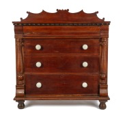 A rare Colonial casuarina four drawer chest with turned split columns, grained decoration, porcelain knobs, ogee moulded top drawer with bead and reel applied moulded decoration, Western Australian origin, circa 1875, Baltic pine secondary timbers with sc