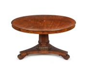 A Colonial Australian cedar circular tilt-top dining table, the top impressively crafted from a single slab of Australian cedar with thumbnail moulded edge and flame veneer cedar skirt. Full cedar secondary construction, with tapering faceted column, fine