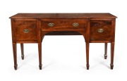 An early Colonial Australian cedar six leg sideboard in the Sheraton manner with huon pine stringing, diamond escutcheon inlays, tapered legs terminating in spade feet, New South Wales origin, circa 1820. Each drawer blade veneered in cedar on solid beefw