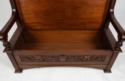 R. G. KIRKHAM antique Australian blackwood hall seat with lift-top storage box base. Impressively carved with griffin heads, pomegranates and fish scale borders, early 20th century, ink stamp to the interior "R. & G. Kirkham, 22 Latrobe Parade, Melbourne" - 2