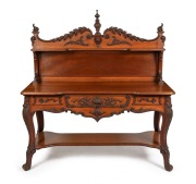 An antique Australian cedar and Queensland walnut servery table with ornately carved acanthus decoration, Melbourne origin, circa 1880, ​​​​​​​149cm high, 1398cm wide, 56cm deep.