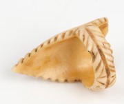 An antique carved whalebone sweetheart toggle inlaid with abalone shell, 19th century, ​​​​​​​3cm high - 2