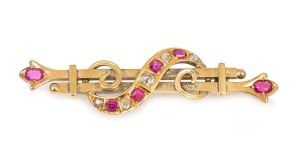 FISCHER of Geelong antique 15ct gold brooch adorned with rubies and rose cut diamonds, 19th century, stamped "E. FISCHER, 15ct", 5.5cm wide, 5.4 grams.