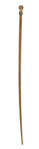 An antique whalebone walking stick with carved whale's tooth double Turkman knot grip and finely turned tapering whalebone spiral shaft, 19th century, 85.5cm high.