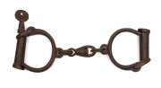 HIATT "Backstrap Hinge" convict handcuffs with key, circa 1840, 23cm wide.