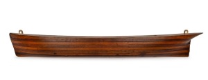 Half hull boat builder's antique model, cedar and pine laminated construction with removable peg joints, 19th century, 10 x 72cm.