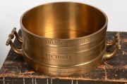 An exceptional set of three Imperial Standard measures, Bushel, Half Bushel and Peck, solid cast brass, 19th century, engraved "VICTORIA, J. M'EWAN & Co. LONDON AND MELBOURNE", housed in two original timber cases, Bushel measure 24cm high, 67cm across the - 6