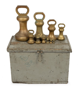 117 · An impressive set of ten cast brass bell weights in original fitted timber travelling case, 56lb to 2 oz. 19th/20th century, the case 41cm high, 63cm wide, 41cm deep.