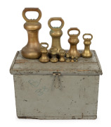 An impressive set of ten cast brass bell weights in original fitted timber travelling case, 56lb to 2 oz. 19th/20th century, the case 41cm high, 63cm wide, 41cm deep.