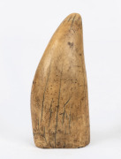 An antique sperm whale tooth, holed and cut base, 19th century, 15.5cm high.
