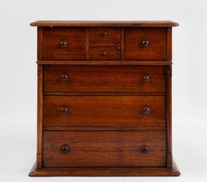 An Australian folk art miniature chest of drawers, constructed from cigar box cedar, late 20th century, 28cm high, 27cm wide, 16cm deep