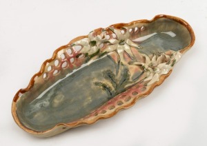 CASTLE HARRIS pierced pottery dish with applied flannel flower decoration, incised "Castle Harris", 29cm wide.