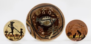 GUY & MARTIN BOYD group of three pottery plates with hand-painted and sgraffito Aboriginal decoration, incised signatures to base, the largest 26cm diameter