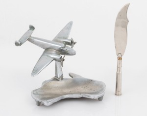 A trench art paperknife; together with a chrome aeroplane desk ornament with Australian map base, WWII Period, (2 items), the aeroplane 15.5cm wingspan