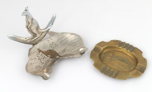 237 · SYDNEY HARBOUR BRIDGE commemorative brass ashtray; together with a souvenir of Sydney nickel plated map of Australia ashtray with boomerang and kangaroo plus engraved decoration, circa 1930/40s, (2 items), 13.5cm and 16cm wide.