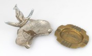 SYDNEY HARBOUR BRIDGE commemorative brass ashtray; together with a souvenir of Sydney nickel plated map of Australia ashtray with boomerang and kangaroo plus engraved decoration, circa 1930/40s, (2 items), 13.5cm and 16cm wide.