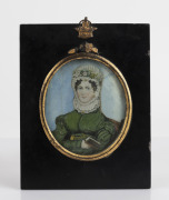 An antique miniature portrait of a lady in a green dress, hand-painted on ivory in an ebonised and gilt frame, 19th century, ​​​​​​​18 x 14cm overall